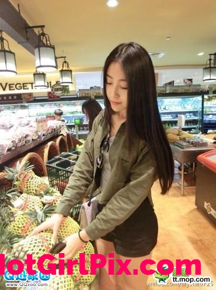 Beautiful girl at a grocery store