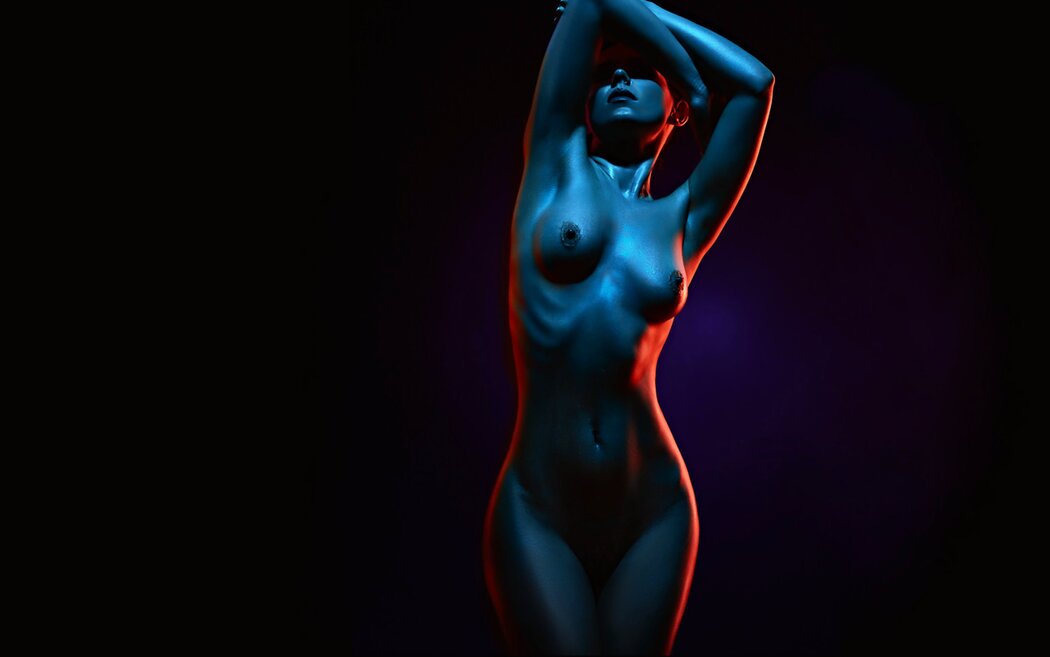 Naked Girls On A Dark Background