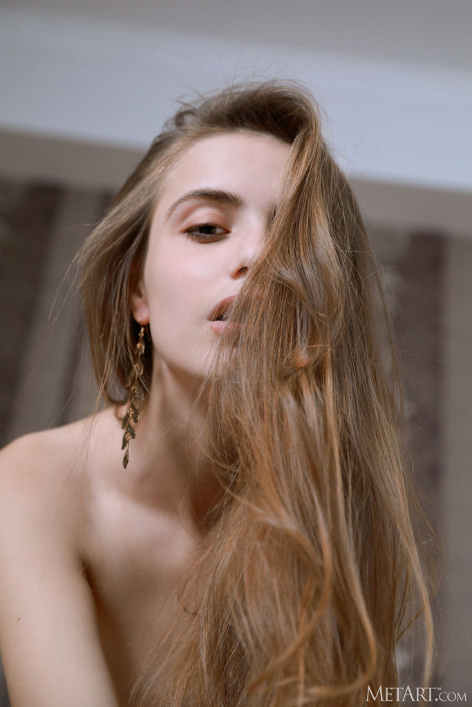 Elle Tan Pulls Her Panties Down Around Her Thighs For A Superb Rear View Of Her Shaved Pussy