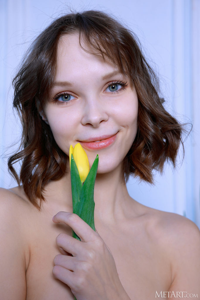 Kitty Gem Spreads Her Thighs To Reveal Her Shaved Pussy