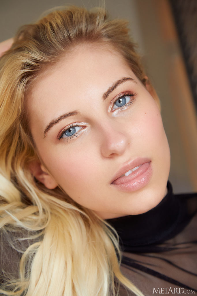 Lilly Bella Spreads Her Long Legs For An Intimate View Of Her Shaved Pussy