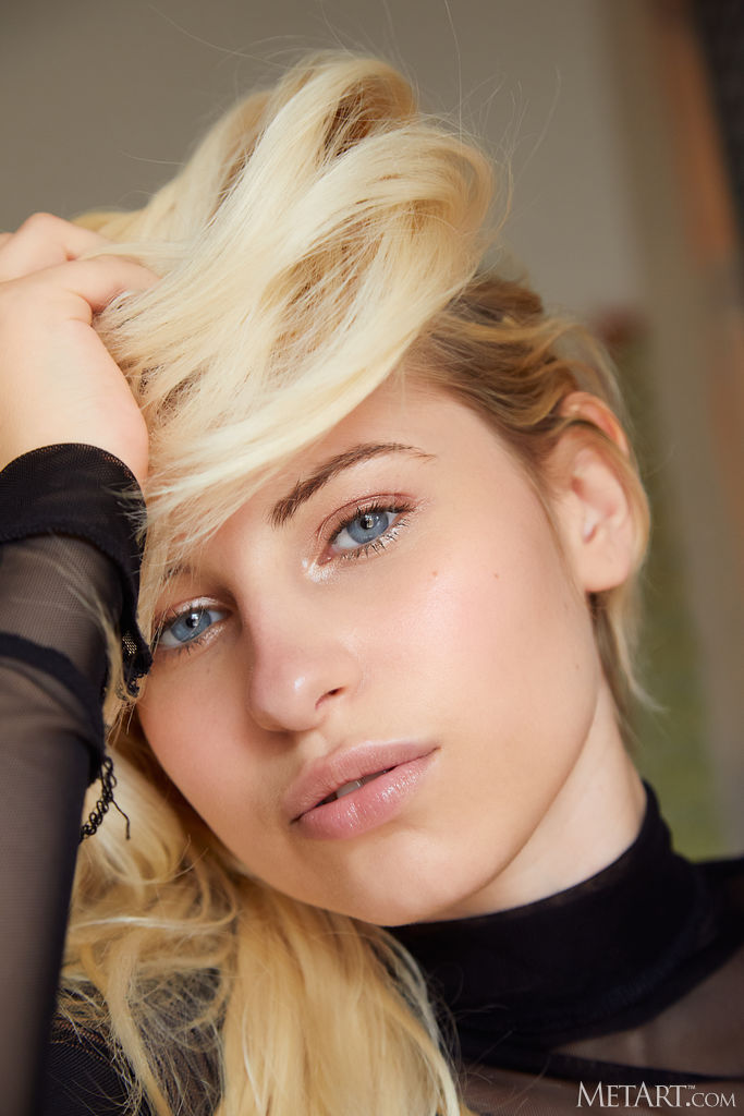 Lilly Bella Spreads Her Long Legs For An Intimate View Of Her Shaved Pussy