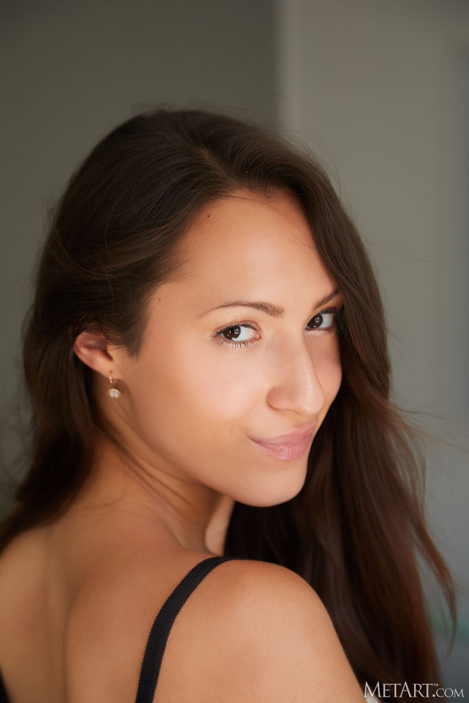 Mishel Dark Sliding Her Panties Down Her Slender Thighs To Reveal Shaved Pussy