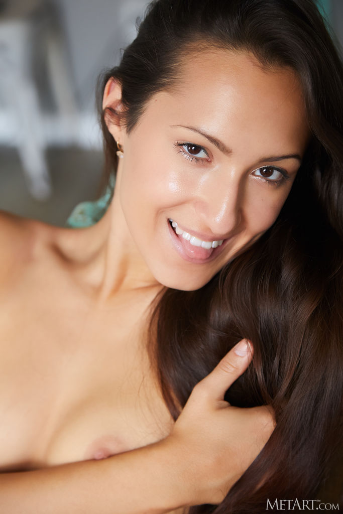 Mishel Dark Sliding Her Panties Down Her Slender Thighs To Reveal Shaved Pussy