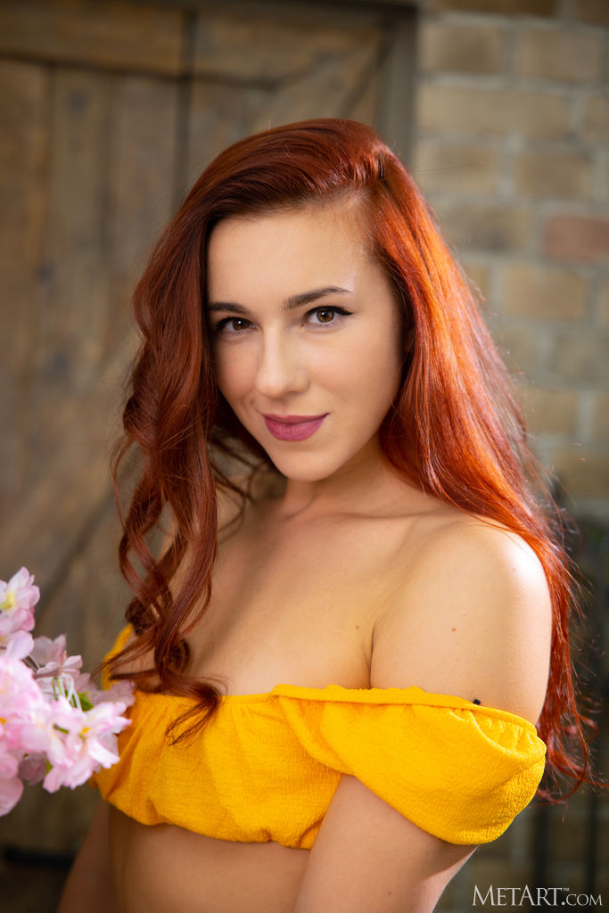 Sexy Redhead Oxi Bendini Kicks Her Long Legs Wide