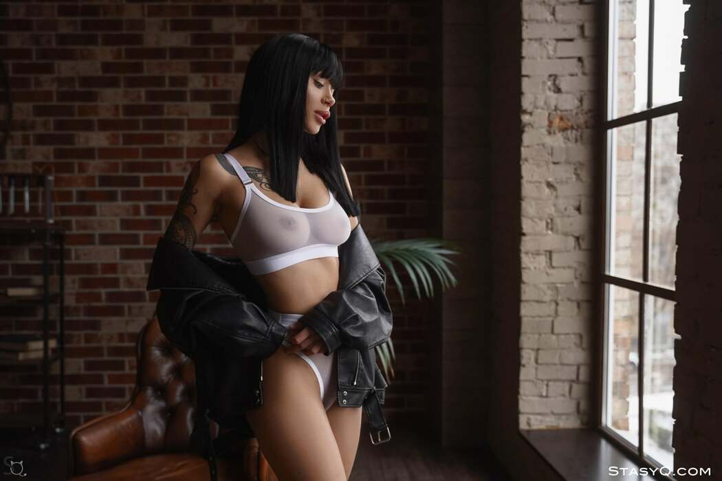 AlishaQ Seduces In Black Hair And Leather As She Poses In Sultry Lingerie Against A Brick Wall