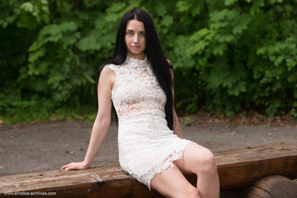 Veronica Snezna Poses In Short Dress And Heels Outdoors On A Bench With Erect Nipples Visible