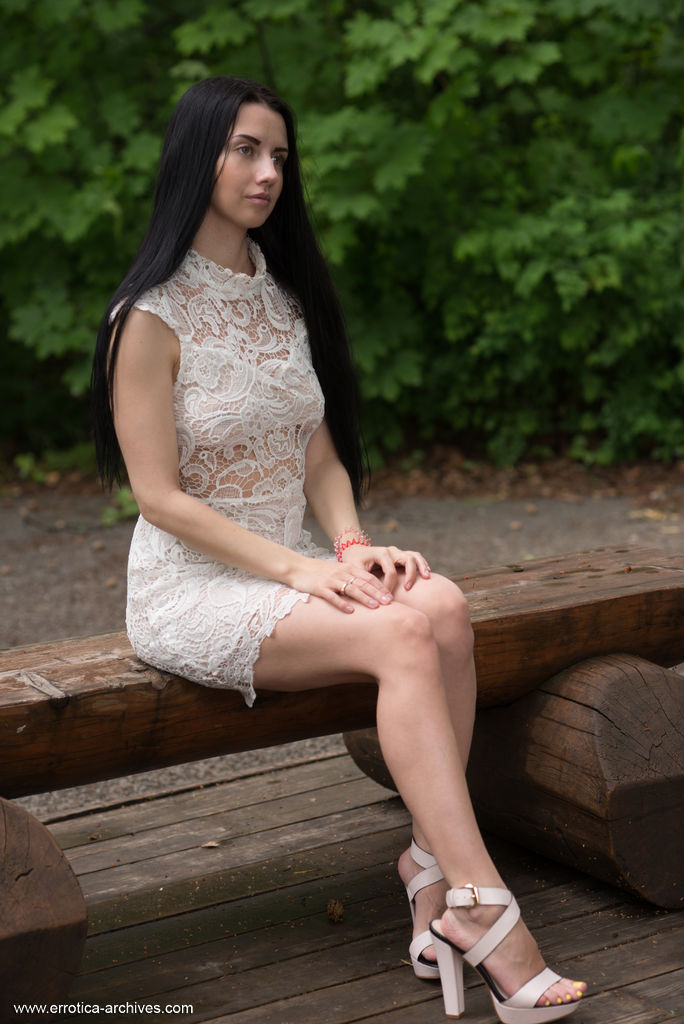 Veronica Snezna Poses In Short Dress And Heels Outdoors On A Bench With Erect Nipples Visible