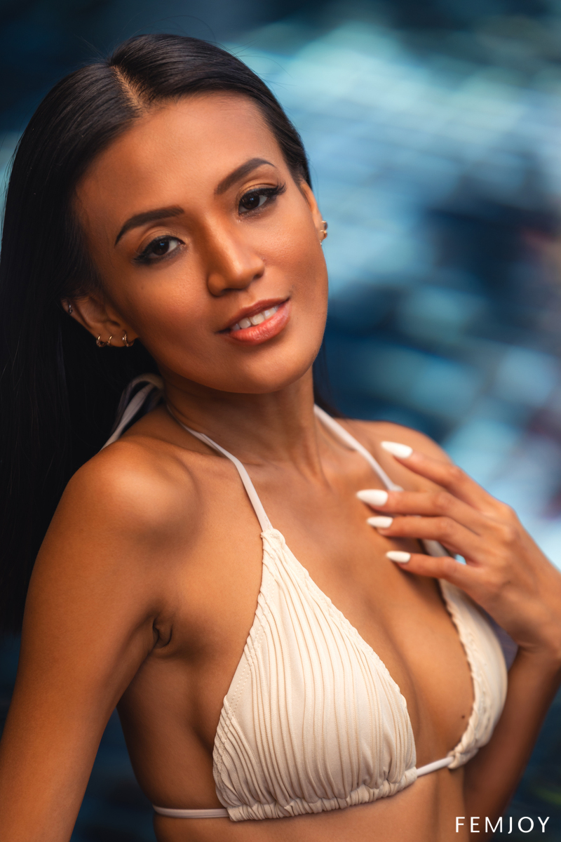 Donnabelle Teases By The Pool In A Creamy Bikini Her Smile And Tattoos Glowing Under Tropical Sun