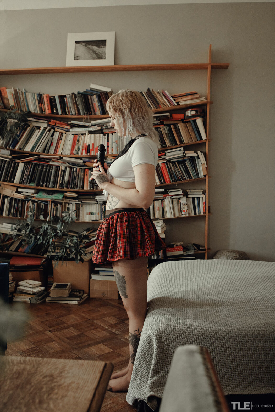 Sem Retlick Grabs Her Ass Enticingly In A Plaid Skirt And Black Pantyhose