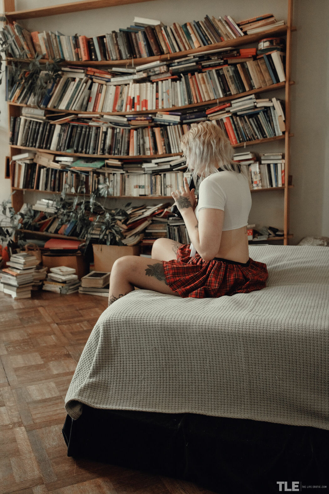 Sem Retlick Grabs Her Ass Enticingly In A Plaid Skirt And Black Pantyhose