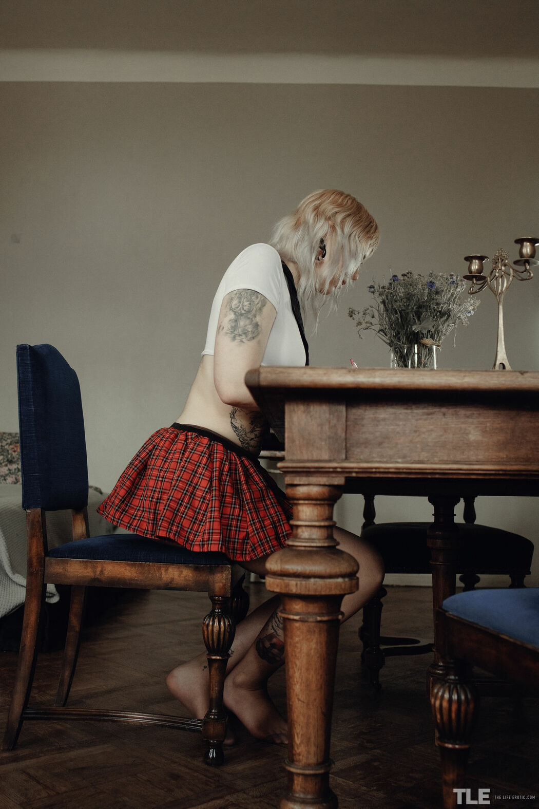 Sem Retlick Grabs Her Ass Enticingly In A Plaid Skirt And Black Pantyhose