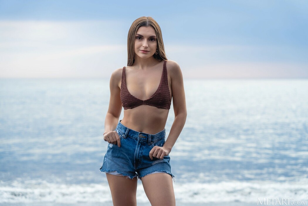 Monika May Siren Squad Strolls Beach In Denim Shorts, Beads Of Water Glisten Cover Photo